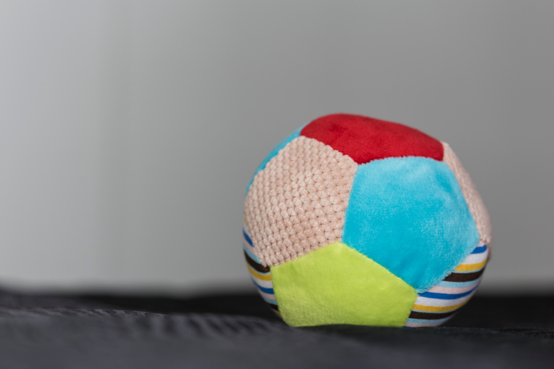 Colorful plush toy ball close up